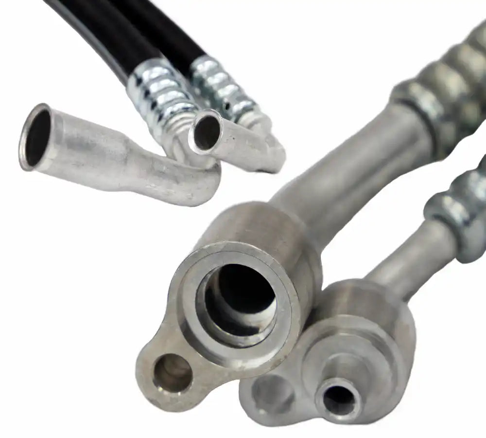 Close-up of AC hoses with direct fit connectors on a white background